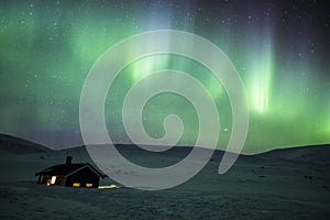 Northern lights in Reinheim Cabin, Dovrefjell National Park, Norway