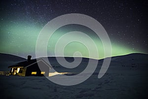 Northern lights in Reinheim Cabin, Dovrefjell National Park, Norway