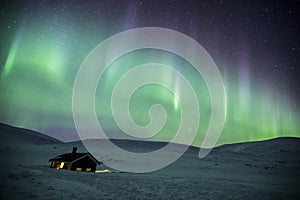 Northern lights in Reinheim Cabin, Dovrefjell National Park, Norway