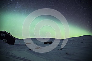 Northern lights in Reinheim Cabin, Dovrefjell National Park, Norway