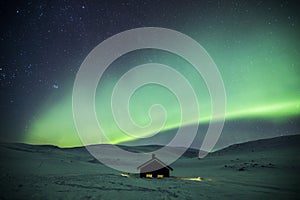 Northern lights in Reinheim Cabin, Dovrefjell National Park, Norway