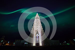 Northern lights shining over the church in Reykjavik