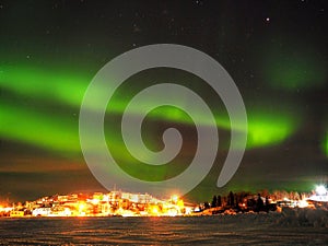 Northern Lights and Stars over City