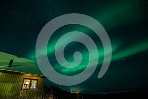 Northern lights in Sweden with cabin