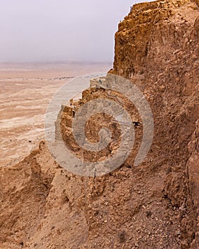 The Northern Palace of Masada in Israel Clings to the Cliffside photo