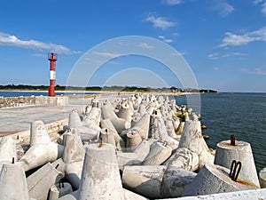 Northern pier with concrete breakwaters and the laser shore rang beacon. Baltiysk, Kaliningrad region