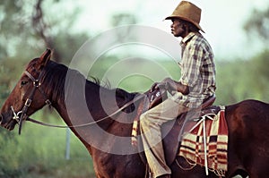 Australian Aborignal stockman on horseback