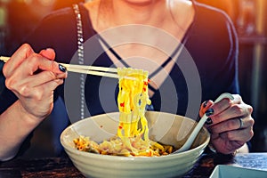 Northern Thai  Curried noodle soup Khao soi with chicken meat and spicy coconut milk