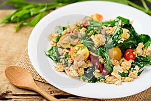 Northern Thai food Pad Pak Chiang Da, stir fried gurmar leaf with egg