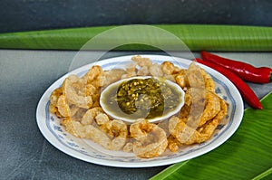 Northern Thai green chili dip cup in pork snatch plate