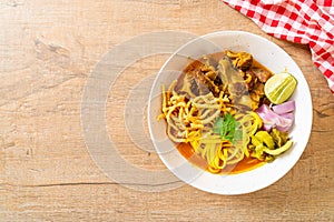 Northern Thai noodle curry soup with braised pork