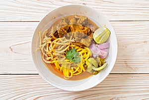 Northern Thai noodle curry soup with braised pork