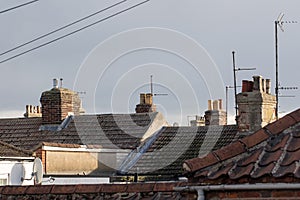 Northern town tiled roof tops with chimneys and aerials UK photo