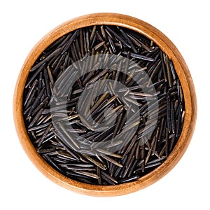 Northern wild rice in wooden bowl