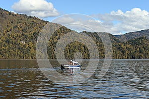 The NorthSilver PRO 745 Cabin boat of the transport police is patrolling the waters of Lake Teletskoye. Altai Republic