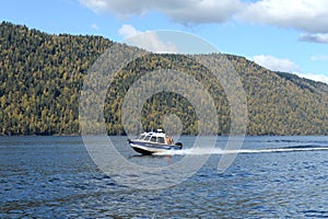 The NorthSilver PRO 745 Cabin boat of the transport police is patrolling the waters of Lake Teletskoye. Altai Republic