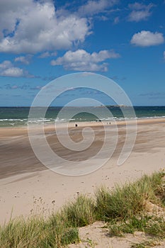 Northumberland beach and coast at Bamburgh north east England UK with view to the Farne islands