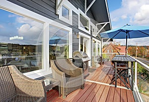 Northwest traditional wooden deck with chairs.