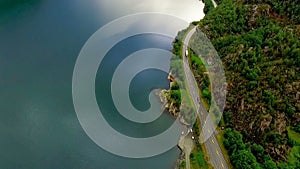 Norway. beautiful landscape of Norway. Road under a mountain along large river