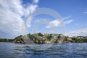 Norway coast with charming cottages in the background, summer, s