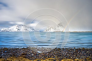 Norway fjord winter landscape with rainbow ,polar circle whether