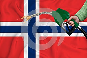 NORWAY flag Close-up shot on waving background texture with Fuel pump nozzle in hand. The concept of design solutions. 3d