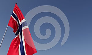 Norway flag on flagpole on blue background. Place for text. The flag is unfurling in wind. Norwegian, Oslo. Europe. 3D