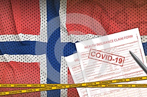 Norway flag and Health insurance claim form with covid-19 stamp. Coronavirus or 2019-nCov virus concept