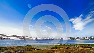 Norway landscape of snowcapped mountain and lake photo