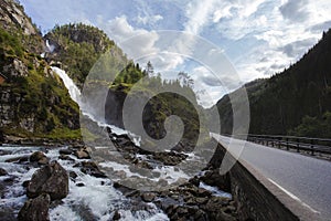 Norway landscape, waterfall near a road. beautiful destinations