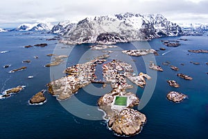 Norway Lofoten Henningsvaer Stadion aerial panoramic  landscape in winter time and mountains covered in snow