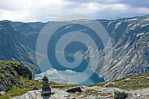 Norway. Mountain lake landscape, Odda. Ringedalsvatnet lake panorama with sunset sky, Way to Trolltunga rock