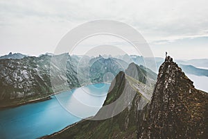 Norway mountain travel man standing on cliff edge photo