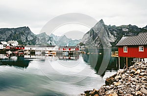 Norway rorbu houses and mountains rocks over fjord