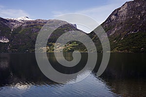 Norway in summer. Mountain reflection in a lake