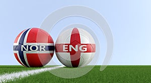 Norway vs. England Soccer Match - Soccer balls in Norways and Englands national colors on a soccer field.