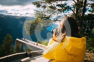 Norway. Young Adult Caucasian Woman Lady Tourist Traveler Photographer Taking Pictures Photos Near Stegastein Viewpoint