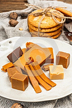 Norwegian brunost with cookies and nuts. Healthy food and eating, organic ingredient for breakfast