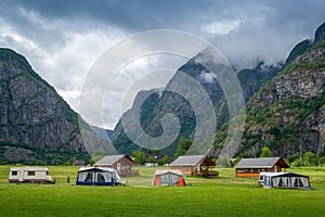 Norwegian camping houses under the high mountains of Eidfjord. photo