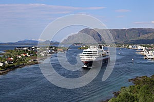 Norwegian coastal steamer leaving port of Bronnoysund