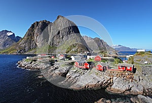 Norwegian fishing village with traditional red rorbu huts, Reine, Lofoten Islands, Norway