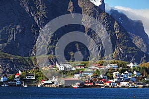 Norwegian fishing village with traditional red rorbu huts, Reine, Lofoten Islands, Norway photo