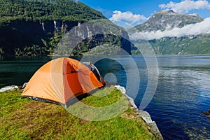 Norwegian fjord landscape with camping tent. Norway adventure.