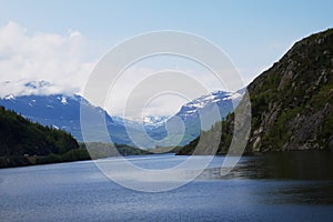 Norwegian fjord with mountains in background, Hardangerfjord