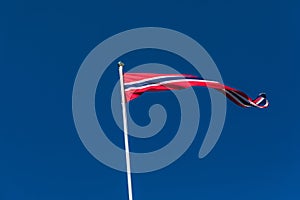 Norwegian flag against blue sky, Norway flag