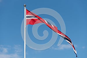 Norwegian flag against the blue sky