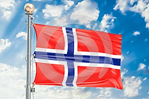 Norwegian flag waving in blue cloudy sky, 3D rendering