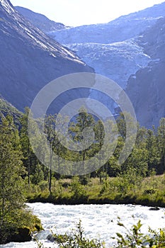 Norwegian Glacier with woods and white water