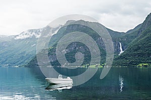 Norwegian landscape with a boat in the fjord