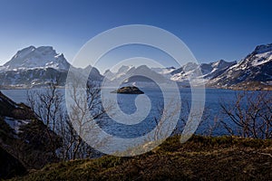 Norwegian sunrise landscape, Lofoten, sea with small islands in the middle